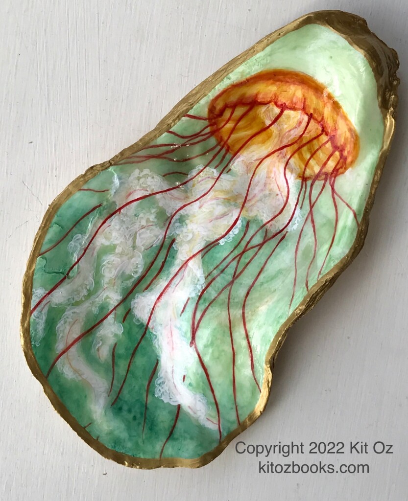 Orange and red jellyfish with lacy white tentacles, on a green background, painted on an oyster shell interior.