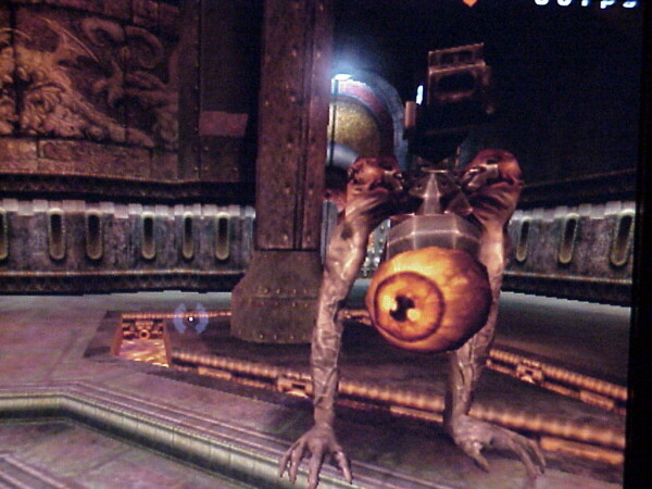 Screenshot of the Quake 3 “Orbb” skin that players could wear in Arena combat. It’s an eyeball the size of a human head, attached with some metallic machinery to sinewy arm-like legs with hands instead of feet. It has a cannon of some kind mounted above its eyeball-body.